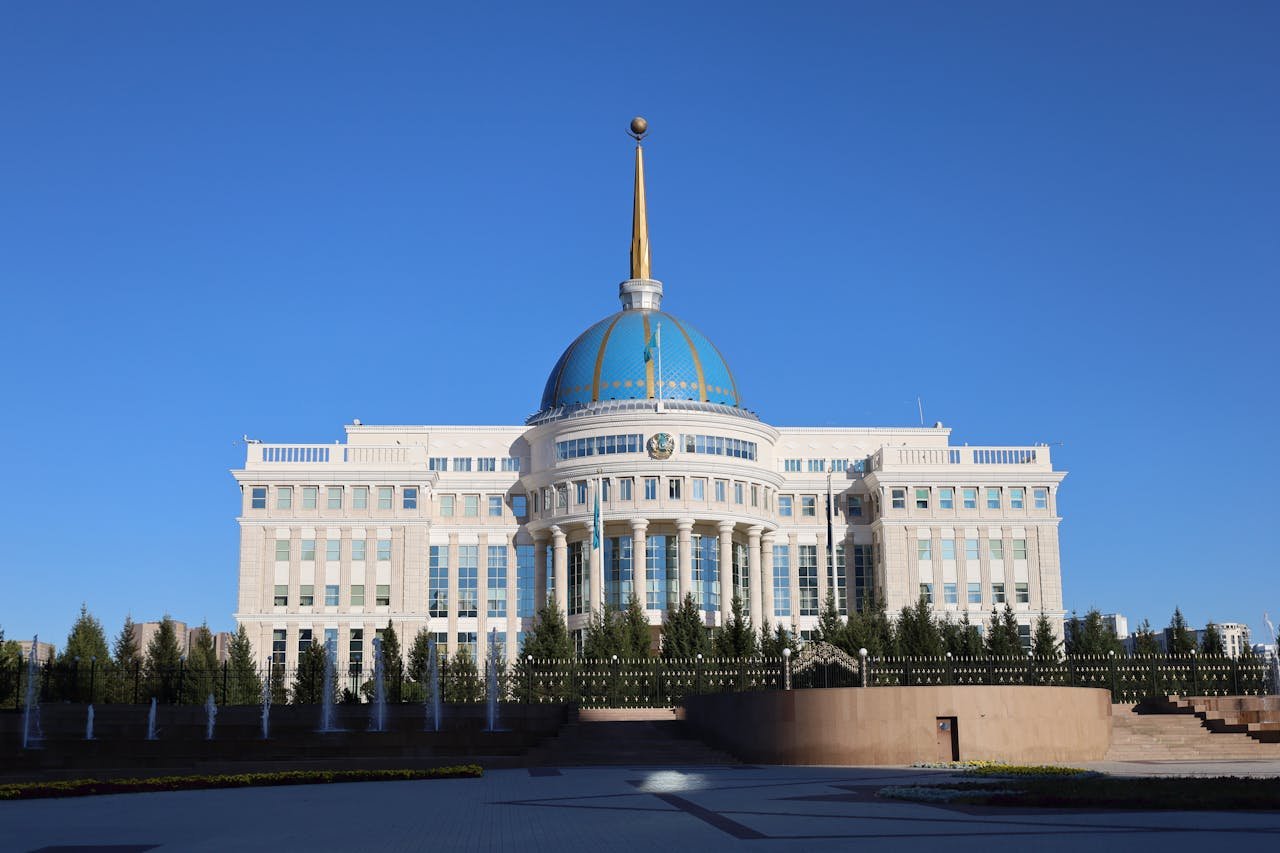 Mastering the First Impression: Your intriguing post title goes here The Ak Orda Presidential Palace with its distinctive blue dome under a clear sky in Astana, Kazakhstan.